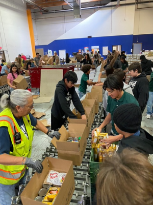 Middle school students at Phoenix Christian Preparatory recently packed food boxes and served at Feed My Starving Children and St. Mary’s Food Bank (photo courtesy of Phoenix Christian Preparatory School).