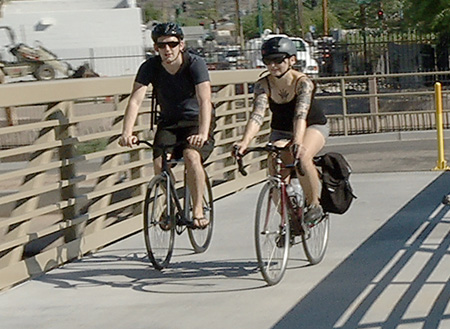 The timing could hardly have been better as the city of Phoenix officially opened a new pedestrian and bicycling bridge crossing the Arizona Canal at 15th Avenue north of Dunlap Avenue, just in time for bike riders and walkers to enjoy the cooler mornings and evenings (photo courtesy of Skyline Productions).