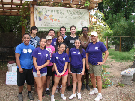 Members of Washington High School’s Interact Club, along with their club adviser, Jill Green (far right) volunteer on a regular basis at Growing Together: A Giving Garden (submitted photo).