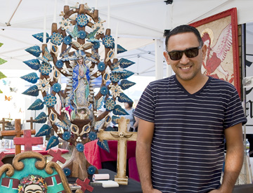Artist Gennaro Garcia displays his Mexican art candleholders during last year’s Phoenix Festival of the Arts (submitted photo).