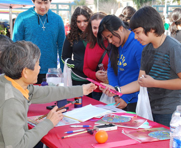 Phoenix teens learn more about calligraphy, a type of visual art related to writing and popular in ancient Chinese cultures, during the annual Chinese Week Culture & Cuisine Festival, which takes place Feb. 7-9 at a new location, Margaret T. Hance Park (submitted photo).