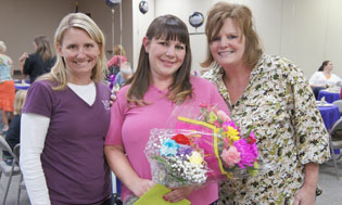 Crystal Thomas, center, is congratulated on her recent graduation from The Bridge to Hope by B2H Director AmySue Seiser, left, and B2H case manager Sallie Jarboe, right (photo by Teri Carnicelli).