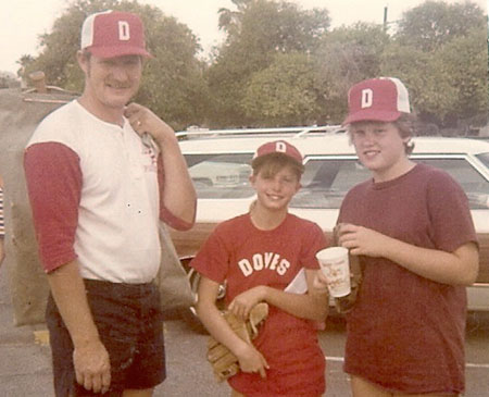 John Murphy Jr. was not only a primary school teacher and a Scout leader, he also coached softball for many years. His two daughters, Jennifer, center, and Jane, right, enjoyed having him as a coach for their Doves softball team (photo courtesy of the Murphy family).