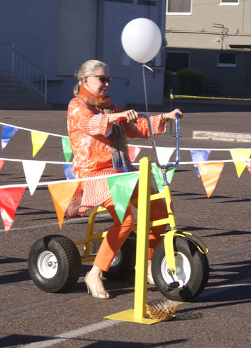 Linda Herold, a Phoenix philanthropist and longtime supporter of Florence Crittenton, prepares to set off on a high-heeled tricycle race in the Diva Dash, part of Florence Crittenton’s annual Heels for Healing benefit shopping event (submitted photo).