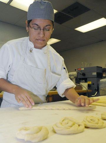 Gina Ostos, who graduated last year from Metro Tech High School, participated in the school’s culinary arts program, where she learned how to bake from scratch, among other skills (submitted photo).