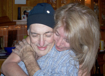 Terry Ratner gives a hug to her husband, Michael, just two weeks before he passed away from esophageal cancer (photo courtesy of Terry Ratner).