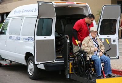 Matt Matthews, a driver with QTS, assists Donald Hansen with getting to his doctor’s appointment courtesy of the free Veterans Transportation Assistance Program (photo courtesy of Quality Transport Services of Arizona).