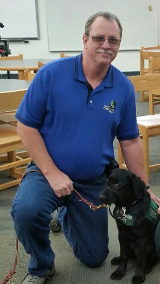Phoenix resident Brad Stocking has been a guide dog puppy raiser for five years and currently is training his seventh dog, a 5-month-old black lab named Uni (submitted photo).