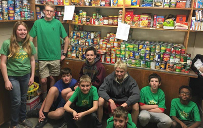Boy Scout Troop 329 Scouts and family members who worked to load and sort food to replenish the shelves of the Church of the Beatitudes Bishop’s Pantry are, from left: Jennifer Brown, Ryan Brown, Alex Dawson, Bennett Buisker, Charlie Talbot, Spencer Cook, John Hubert, Bobby Hubert, and Jay Hurd (submitted photo).