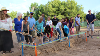 Margo S. O’Neill, Head of School at Villa Montessori School (fifth from left) is joined by members of the staff and school community in breaking ground on the school’s $5.8 million expansion (photo by Elizabeth Van Wie).