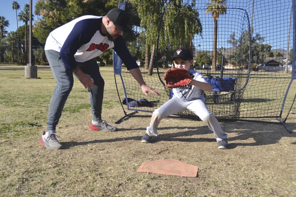 Corey Loyd, director of baseball for Recreation Association of Madison Meadows & Simis (RAMMS) helps his son, Maddox, 9, practice ahead of the RAMMS’ baseball season, which is scheduled to start March 13 (photo by Colleen Sparks).