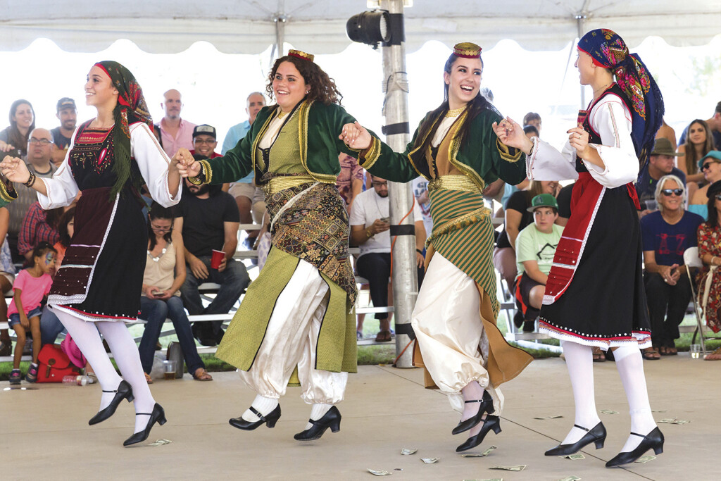 Sophia Scaccia, Eleni Watson, Athena Krestedemas and Anna Fourlis perform a Greek dance at a previous The Original Phoenix Greek Festival at the Holy Trinity Greek Orthodox Cathedral. This large, popular festival will return this year after it was canceled last year due to the COVID-19 pandemic (photo by KGallagher).