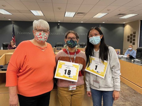 Paula McWhirter, director of Curriculum and Instruction at WESD, congratulated Abigail H. (middle), and Yannis W., the first and second place winners of the District Spelling Bee (photo courtesy of Washington Elementary School District).